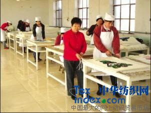 把福娃掛毯做進奧運的女人